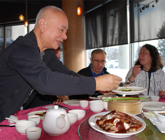 Patrick serves Peking Duck